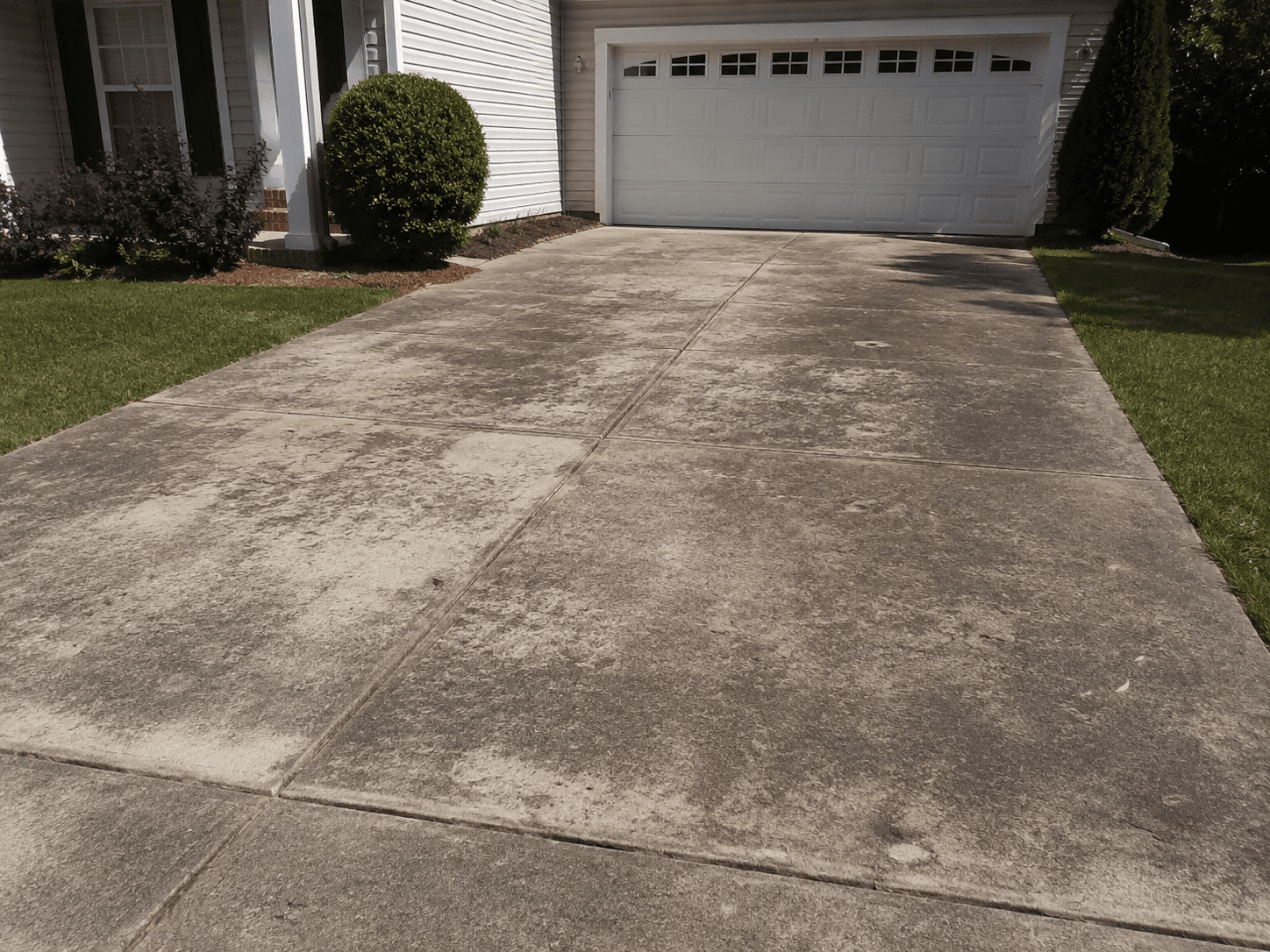 Driveway before pressure washing (temporary AI concept image)